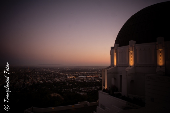 The sun sets over Los Angeles and the Griffith Observatory